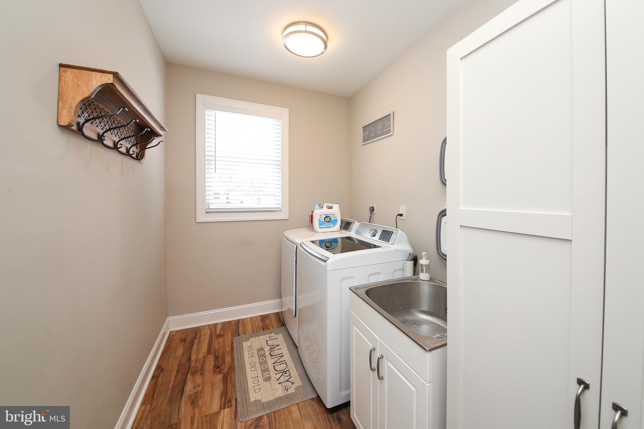 1148 Independence Way Hatfield, PA 19440 - Photo 16 of 33 a utility room with a sink a washer and dryer
