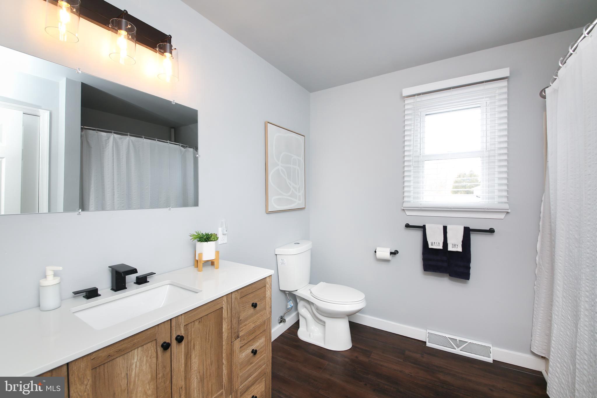 1148 Independence Way Hatfield, PA 19440 - Photo 23 of 33 a bathroom with a toilet sink and mirror