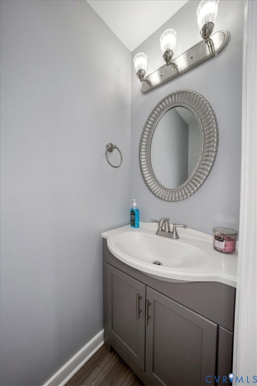 11201 Puckett Place Midlothian, VA 23112 - Photo 11 of 23 a bathroom with a sink and a mirror