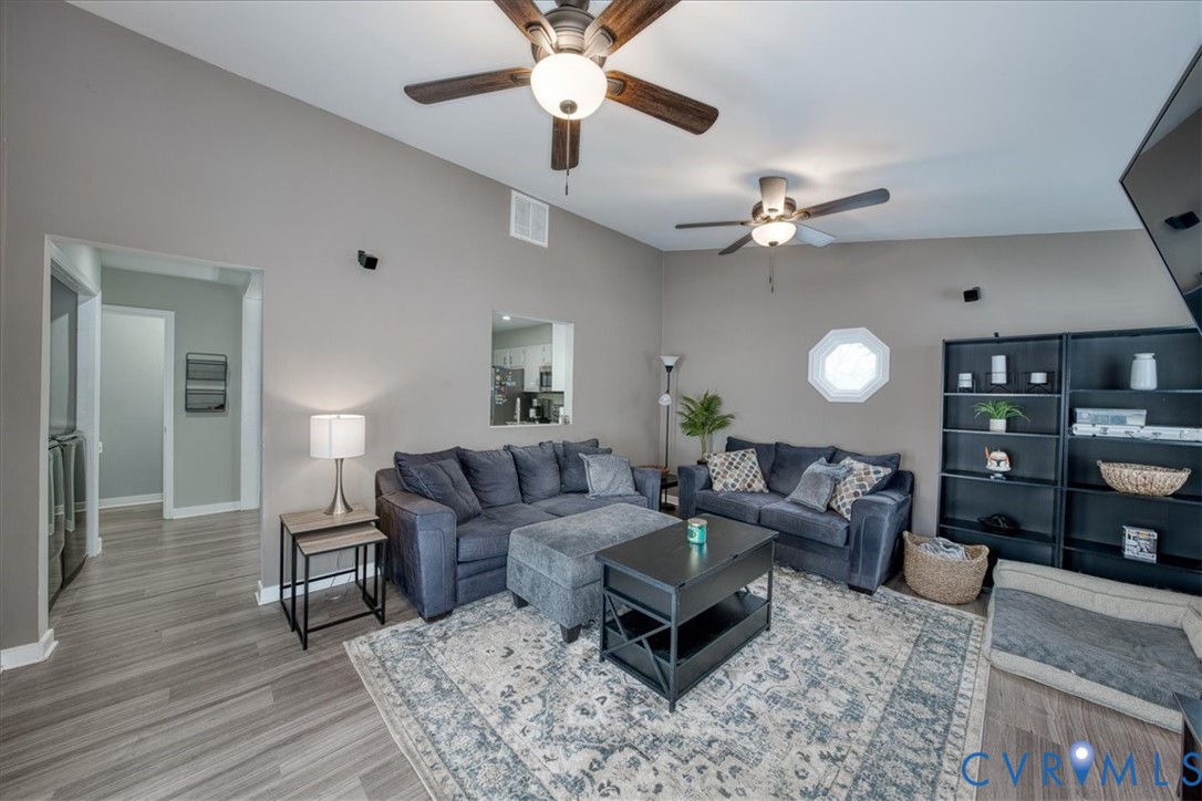 11201 Puckett Place Midlothian, VA 23112 - Photo 14 of 23 a living room with furniture and a wooden floor