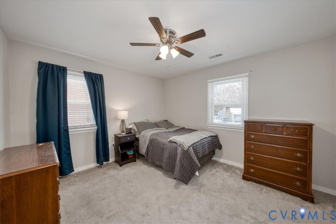 11201 Puckett Place Midlothian, VA 23112 - Photo 16 of 23 a bed room with a bed and a window