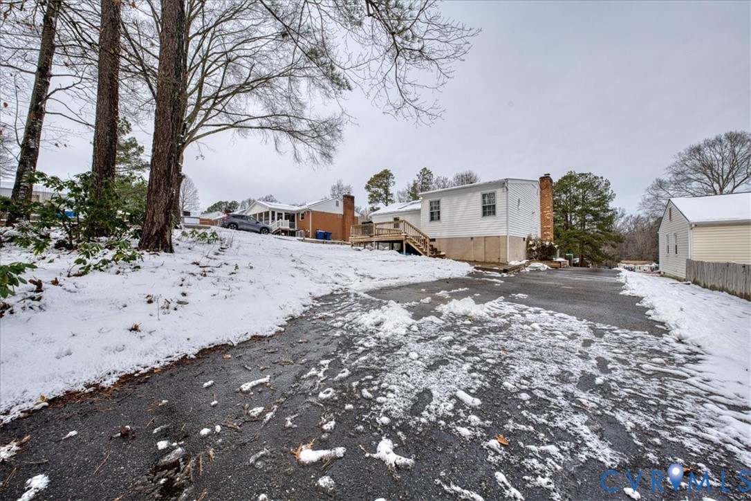11201 Puckett Place Midlothian, VA 23112 - Photo 21 of 23 a view of a dry yard covered with snow
