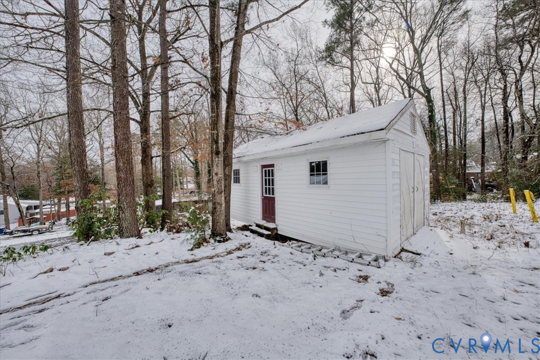 11201 Puckett Place Midlothian, VA 23112 - Photo 23 of 23 a view of a house with a yard covered in snow