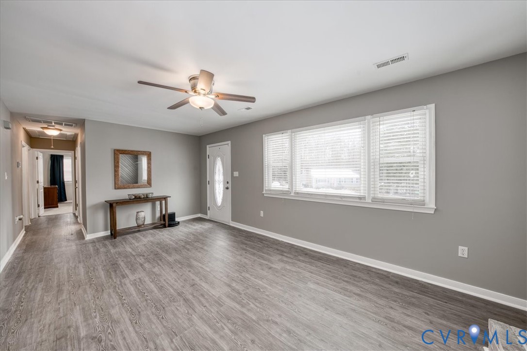11201 Puckett Place Midlothian, VA 23112 - Photo 4 of 23 a view of a livingroom with a hardwood floor and a ceiling fan