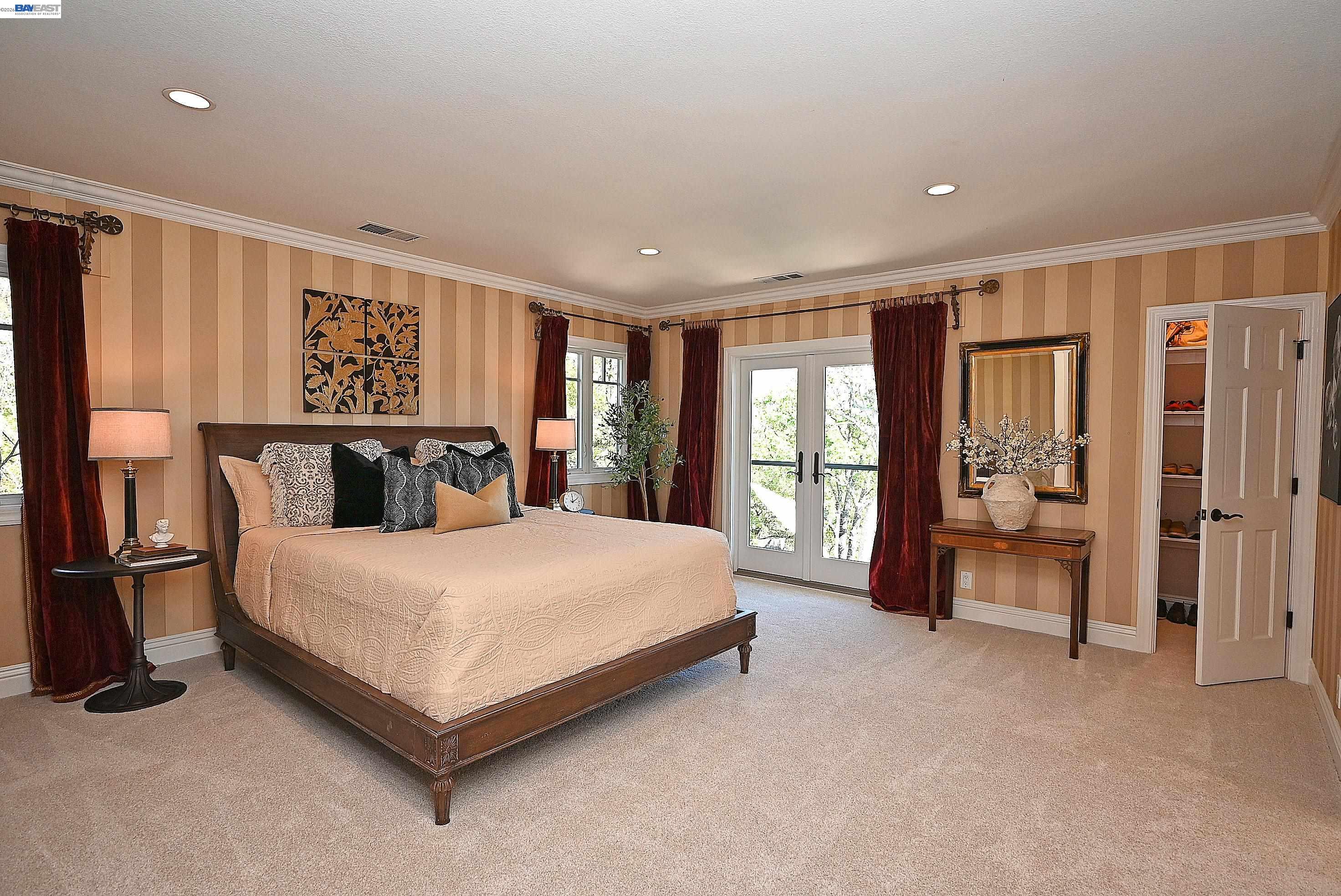 16 Ardendale Court Alamo, CA 94507 - Photo 29 of 58 a spacious bedroom with a large bed and a large window