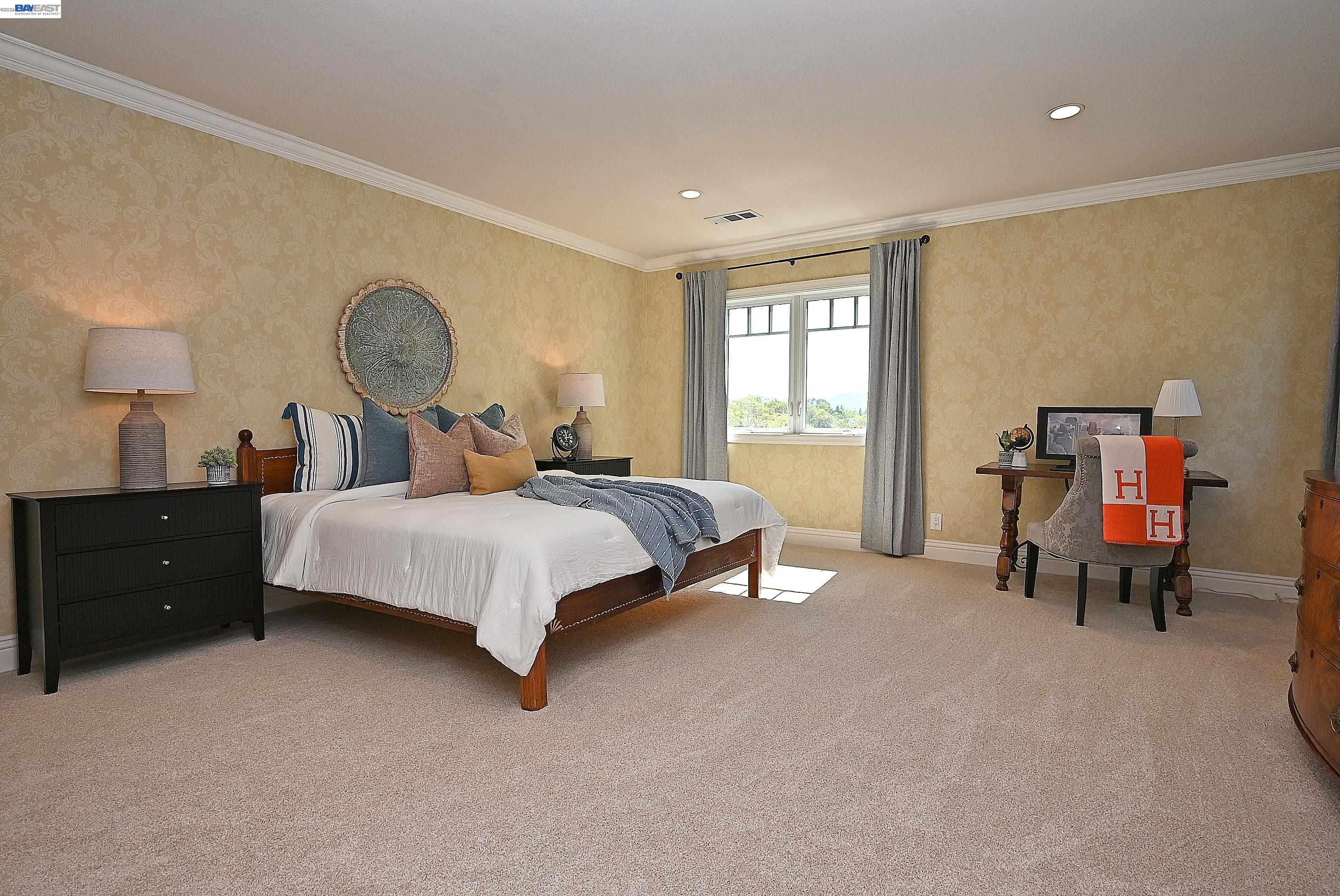 16 Ardendale Court Alamo, CA 94507 - Photo 36 of 58 a bedroom with a bed and a table lamp