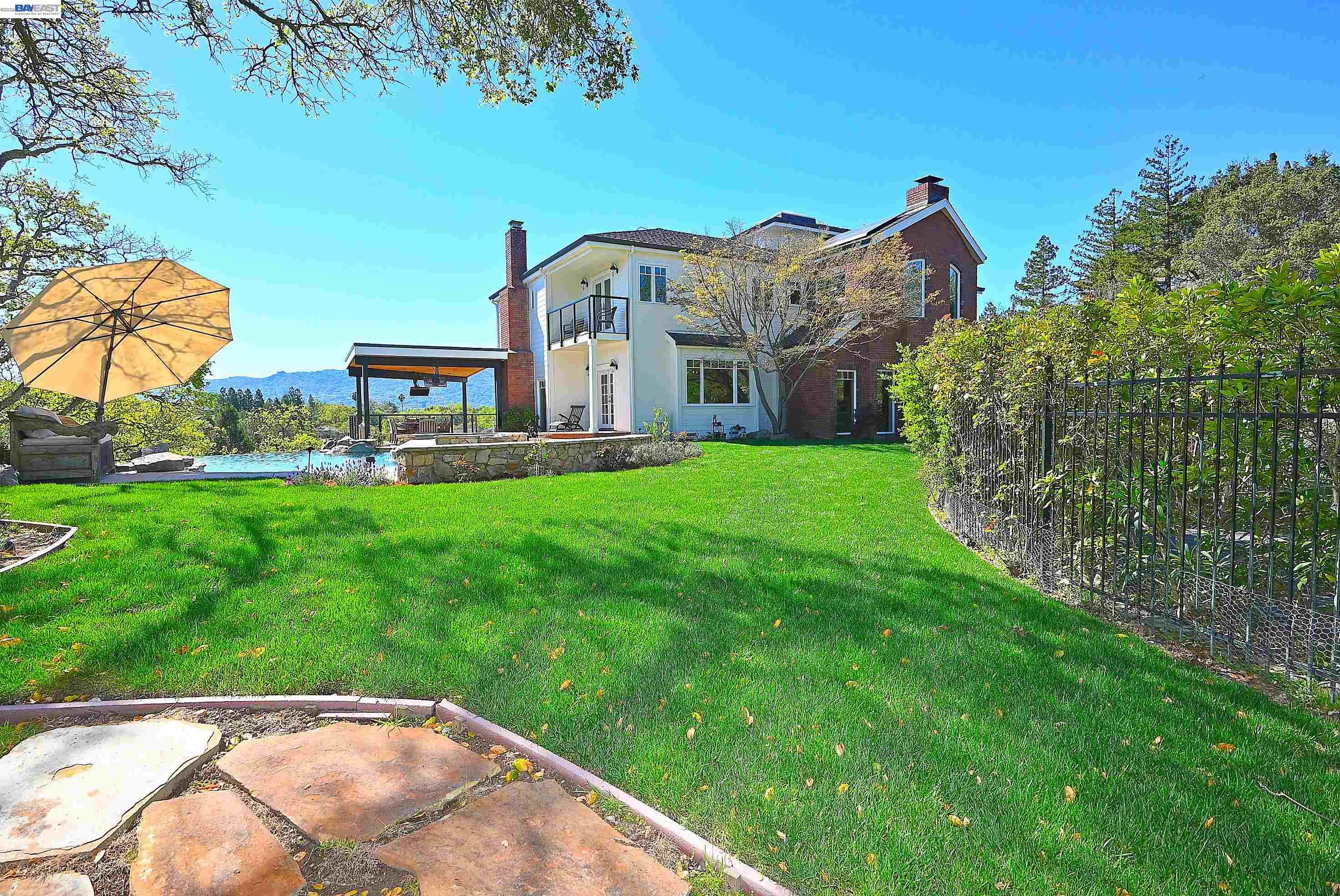16 Ardendale Court Alamo, CA 94507 - Photo 4 of 58 a view of a big house with a big yard and potted plants