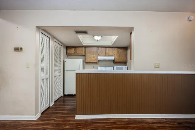 a view of kitchen with cabinets