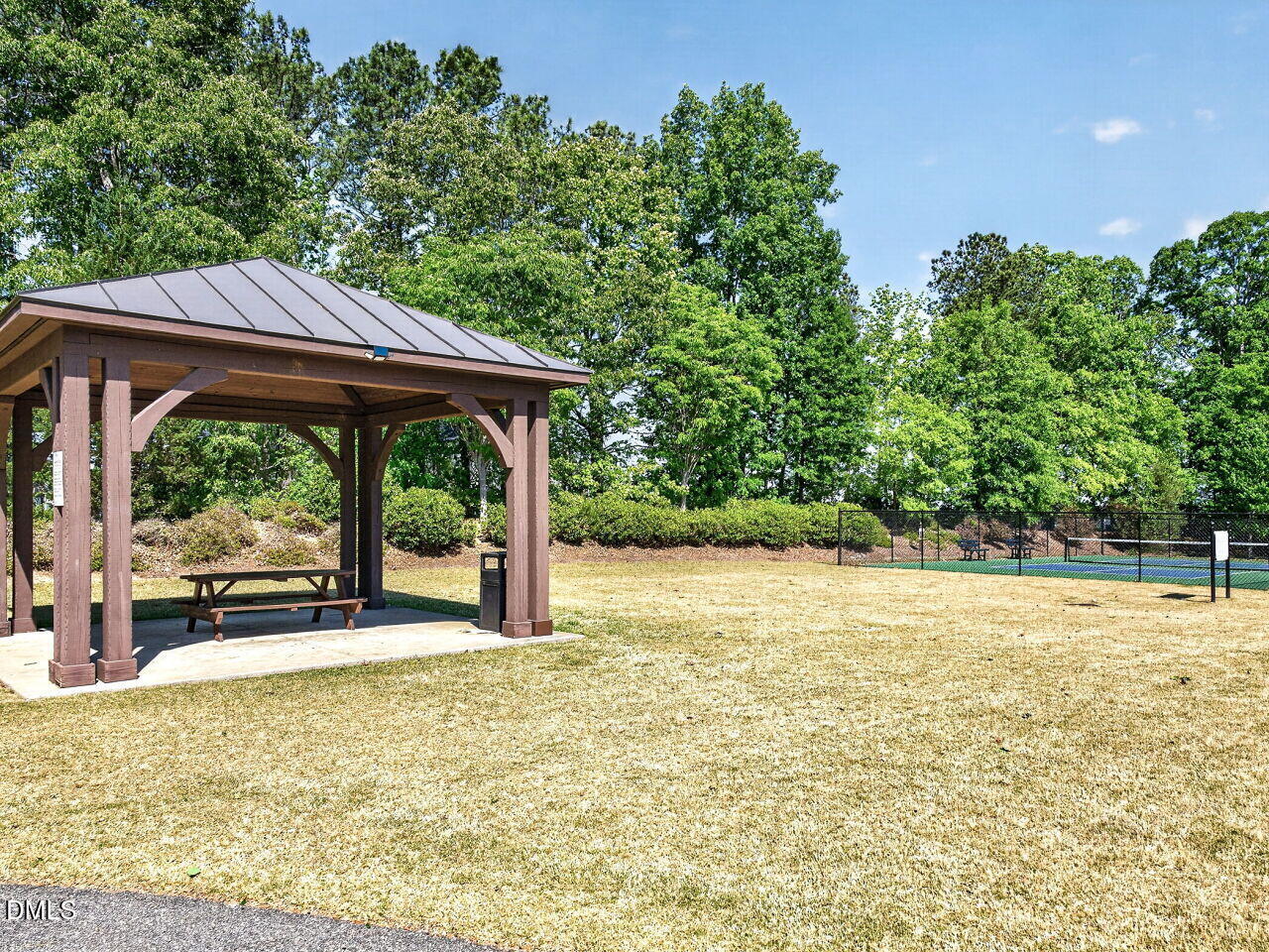 8215 Yaxley Hall Drive Raleigh, NC 27616 - Photo 40 of 42 a view of a swimming pool with a yard