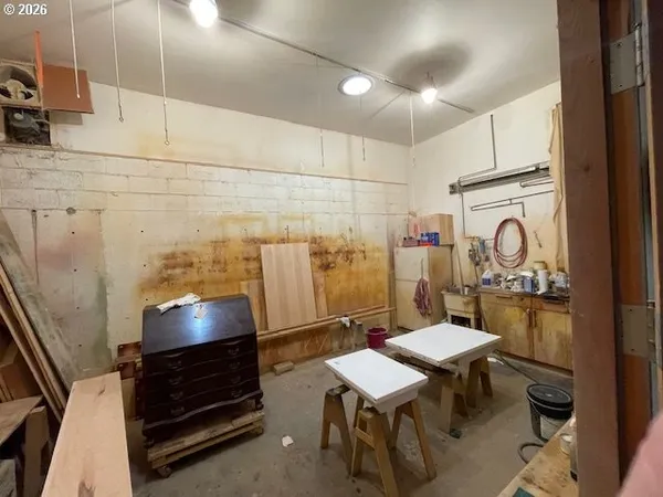 a view of a hallway with wooden floor and a hallway
