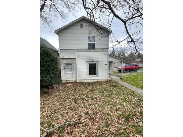 a large white building with a white roof
