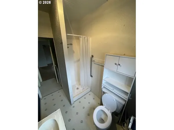 a bathroom with a tub and a shower