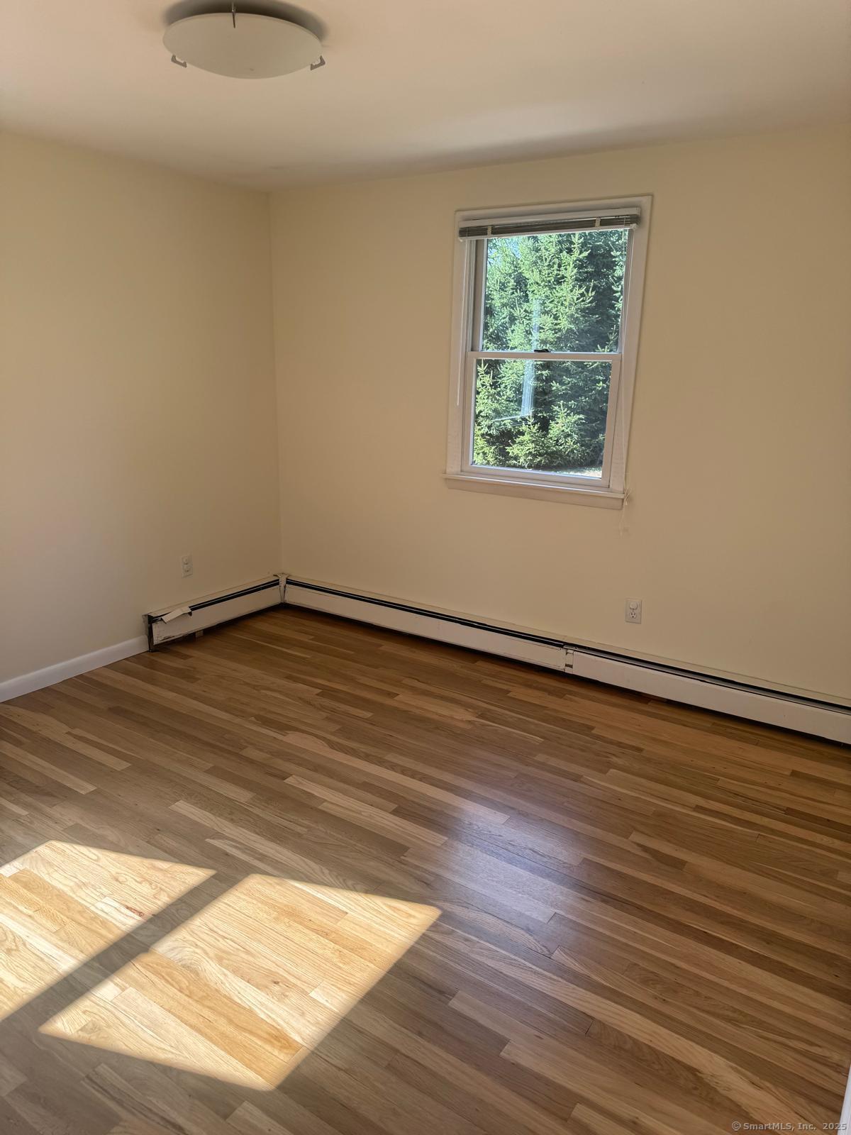 18 Hales Road Westport, CT 06880 - Photo 14 of 26 a view of a room with wooden floor and window