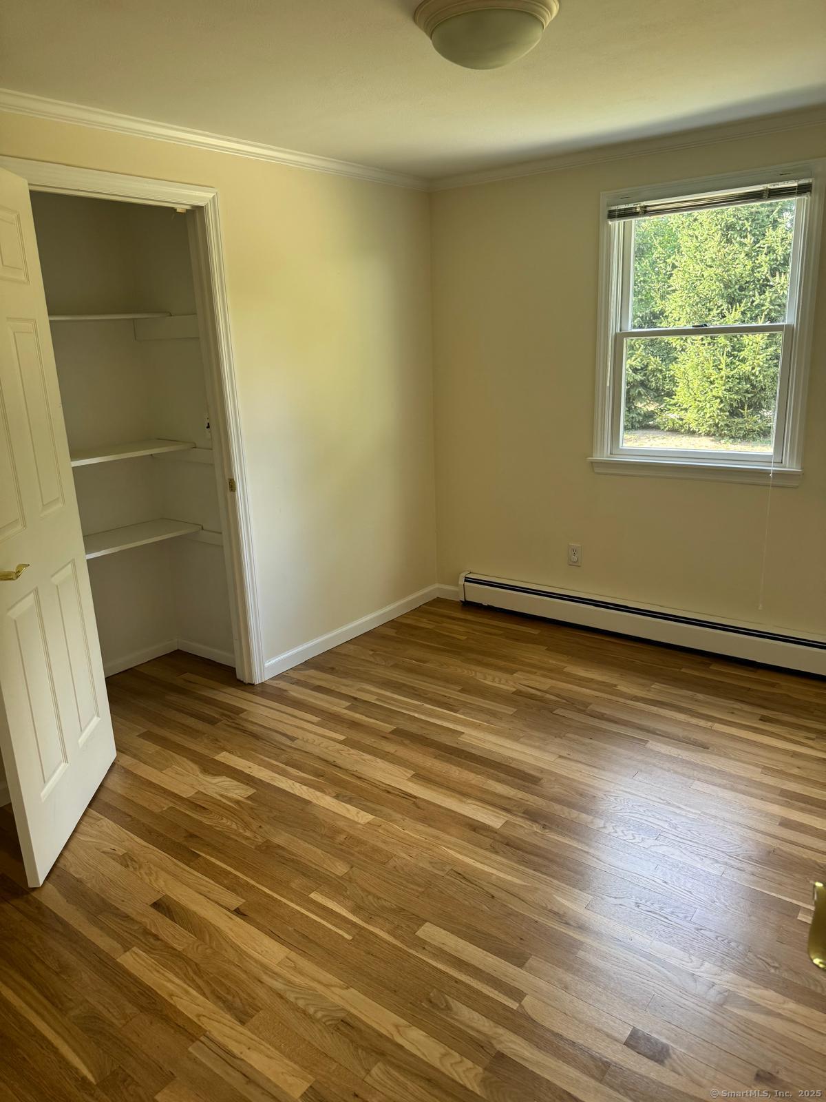 18 Hales Road Westport, CT 06880 - Photo 16 of 26 a view of empty room with wooden floor and fan