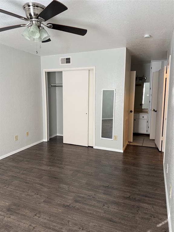 2240 Tarpley Road, Unit 31 Carrollton, TX 75006 - Photo 12 of 18 a view of an empty room with wooden floor