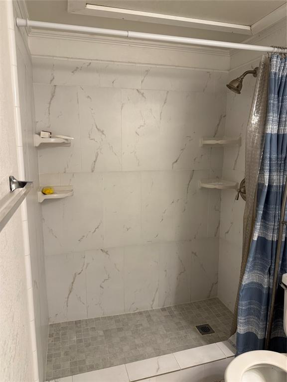 2240 Tarpley Road, Unit 31 Carrollton, TX 75006 - Photo 13 of 18 a bathroom with a shower