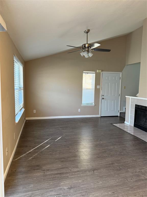 2240 Tarpley Road, Unit 31 Carrollton, TX 75006 - Photo 5 of 18 an empty room with windows and fireplace