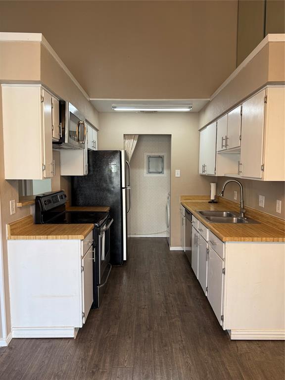 2240 Tarpley Road, Unit 31 Carrollton, TX 75006 - Photo 8 of 18 a kitchen with stainless steel appliances granite countertop a sink a stove and a refrigerator