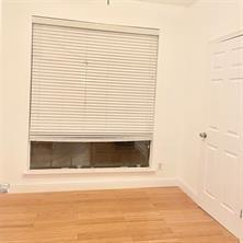 8545 Midpark Road, Unit 11 Dallas, TX 75240 - Photo 11 of 18 a view of a room with wooden floor