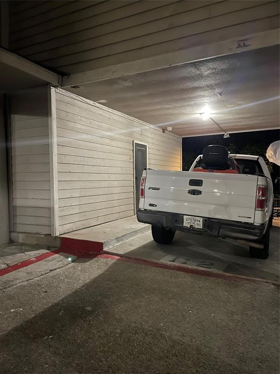 8545 Midpark Road, Unit 11 Dallas, TX 75240 - Photo 17 of 18 a view of car garage
