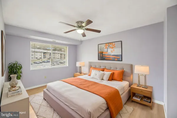 a bedroom with a large bed and a window