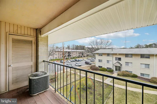 a view of a balcony with furniture
