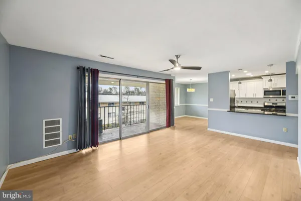 a view of an empty room with a window