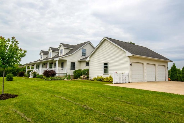 12N330 Switzer Road Elgin, IL 60124 - Photo 2 of 25 a front view of house with yard and green space