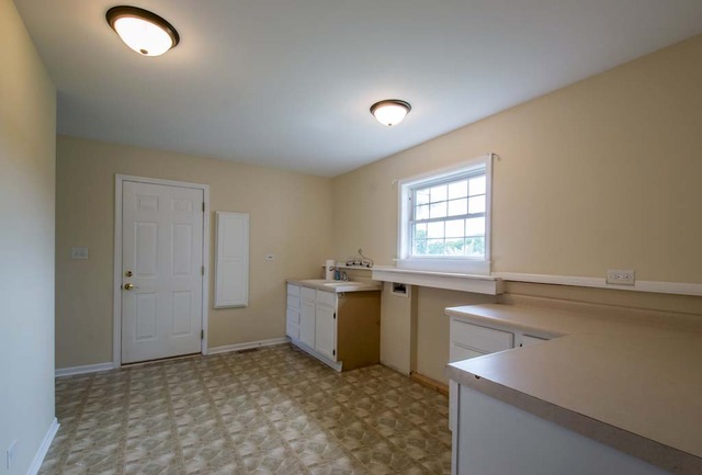 12N330 Switzer Road Elgin, IL 60124 - Photo 14 of 25 a room with a window a sink and a counter top space