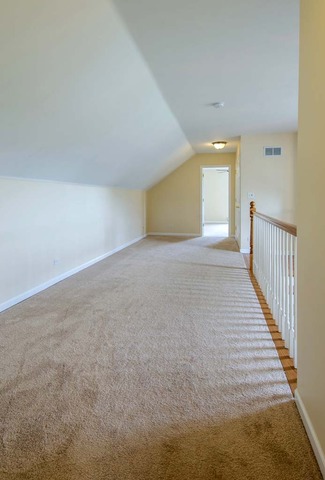 12N330 Switzer Road Elgin, IL 60124 - Photo 19 of 25 a view of an empty room with wooden floor