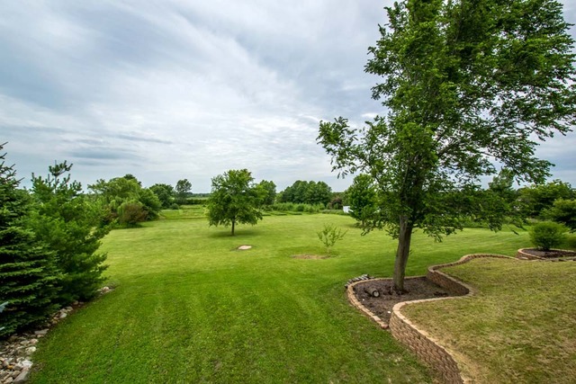 12N330 Switzer Road Elgin, IL 60124 - Photo 23 of 25 a backyard of a house with lots of green space
