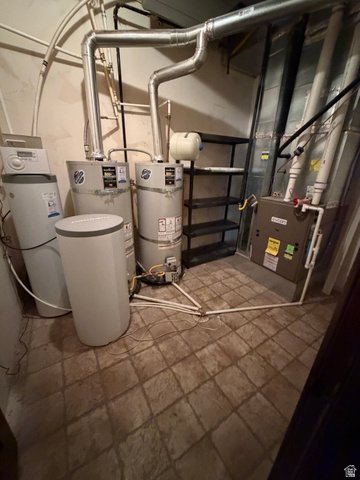 4536 North 475 East Provo, UT 84604 - Photo 64 of 65 Utility area featuring two water heaters, a water softener system, and a furnace unit