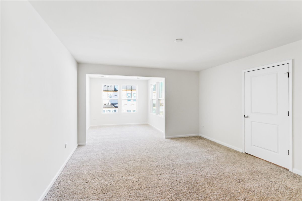 644 Switchgrass Way, Unit 59002 Bolingbrook, IL 60490 - Photo 14 of 26 a view of an empty room with a window