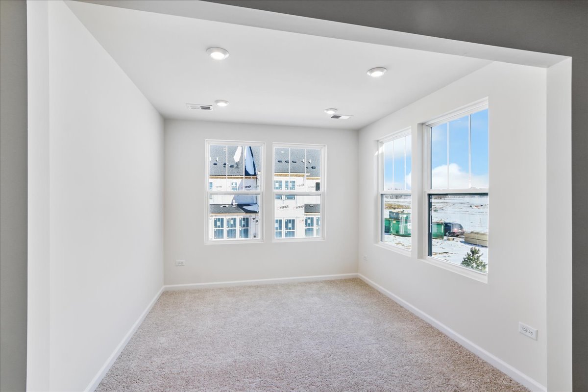 644 Switchgrass Way, Unit 59002 Bolingbrook, IL 60490 - Photo 15 of 26 a view of an empty room with a window