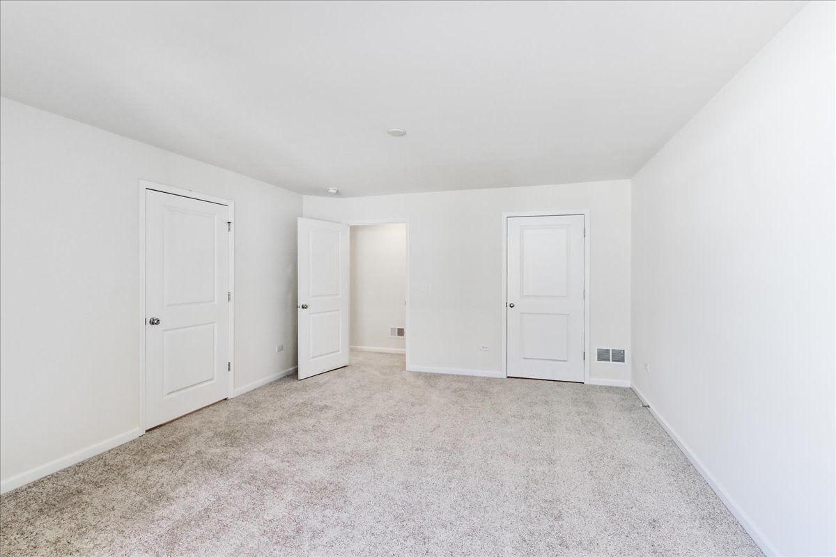 644 Switchgrass Way, Unit 59002 Bolingbrook, IL 60490 - Photo 16 of 26 a view of an empty room