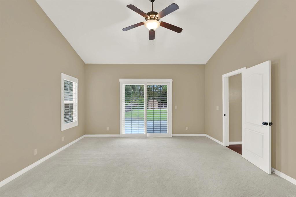 16308 Swartz Canyon Road Ramona, CA 92065 - Photo 15 of 29 a view of a livingroom with a ceiling fan and window