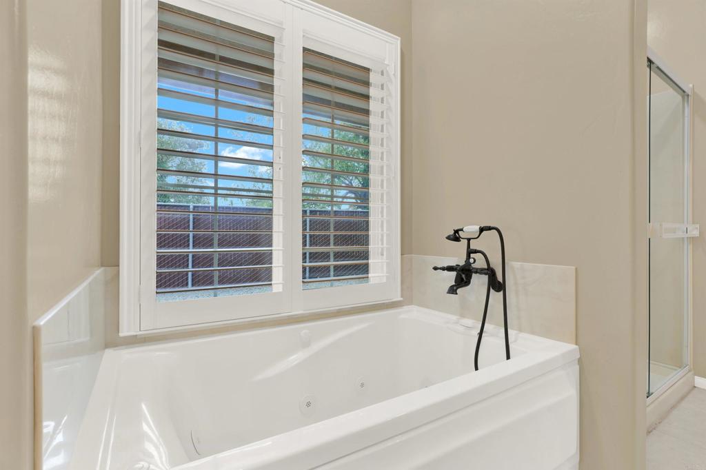 16308 Swartz Canyon Road Ramona, CA 92065 - Photo 17 of 29 a white bath tub sitting next to a window