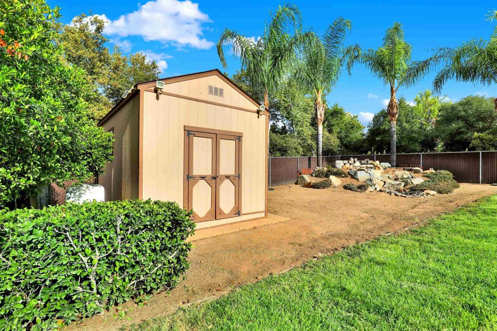 16308 Swartz Canyon Road Ramona, CA 92065 - Photo 25 of 29 a view of backyard of a house with a patio