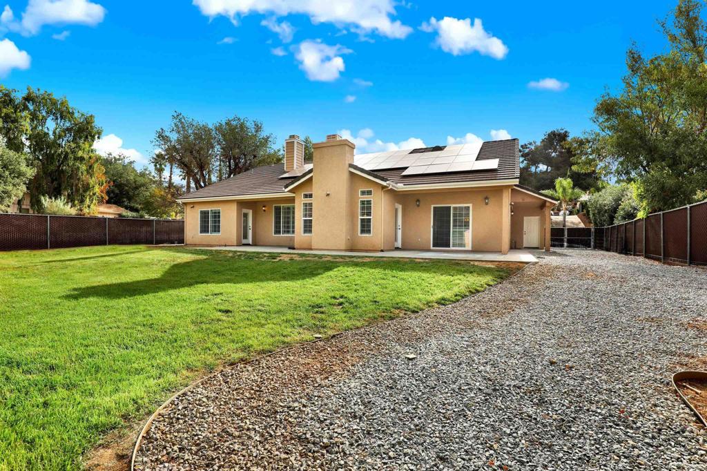 16308 Swartz Canyon Road Ramona, CA 92065 - Photo 26 of 29 a view of a house with a yard