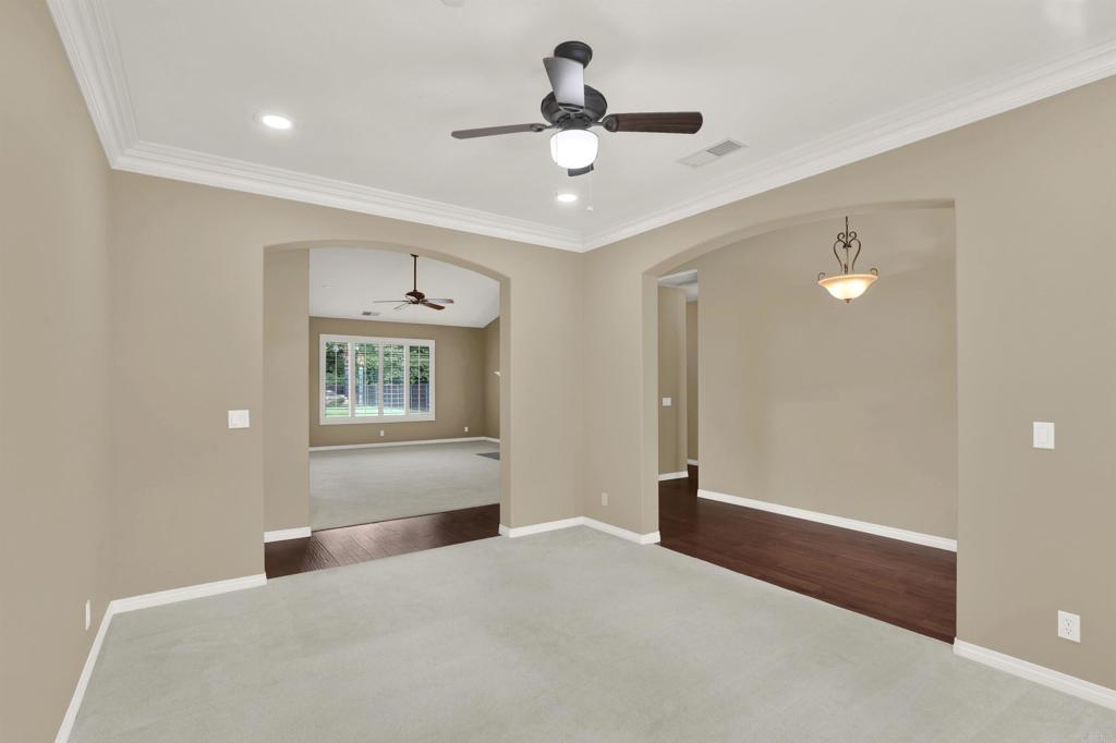 16308 Swartz Canyon Road Ramona, CA 92065 - Photo 9 of 29 a bedroom with a bed and a chandelier fan