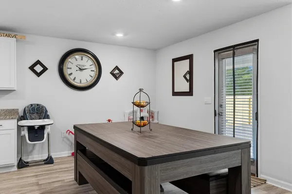 a kitchen with granite countertop a sink and cabinets