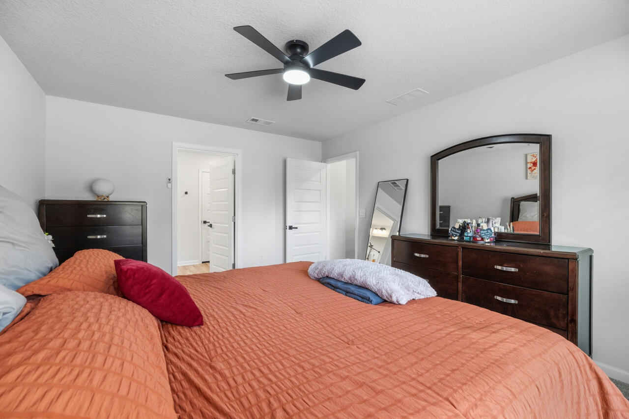 3411 Phoenix Court Crestview, FL 32539 - Photo 21 of 47 a bedroom with a bed and a dresser