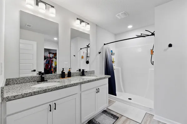 a view of a storage room with a sink and a closet