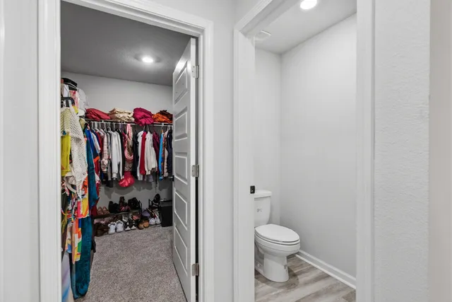 a view of a storage room with a sink and a closet