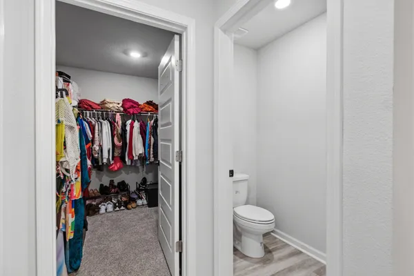 a bedroom with a bed and cabinets