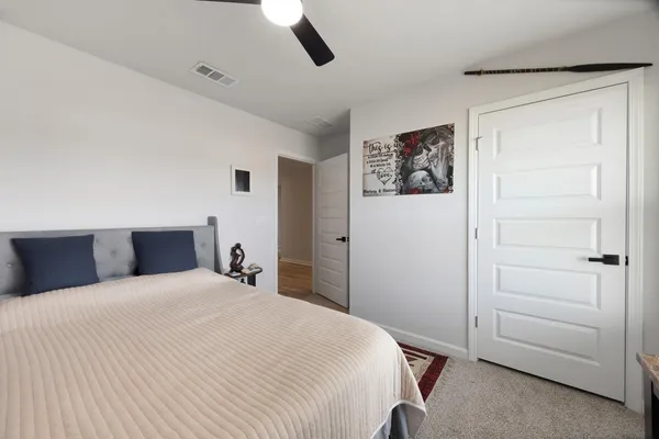 a bathroom with a granite countertop sink toilet a mirror and shower
