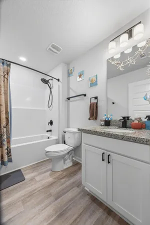 a utility room with sink dryer and washer