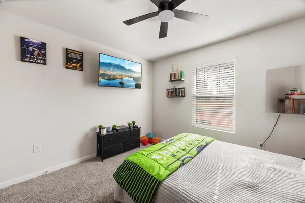 an aerial view of a house with a yard