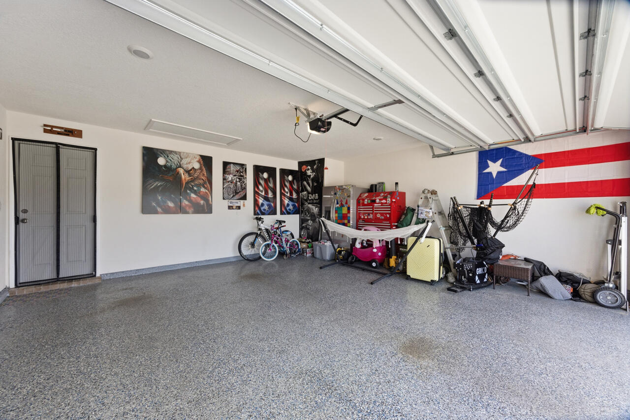 3411 Phoenix Court Crestview, FL 32539 - Photo 35 of 47 a view of a garage with rack and bicycle