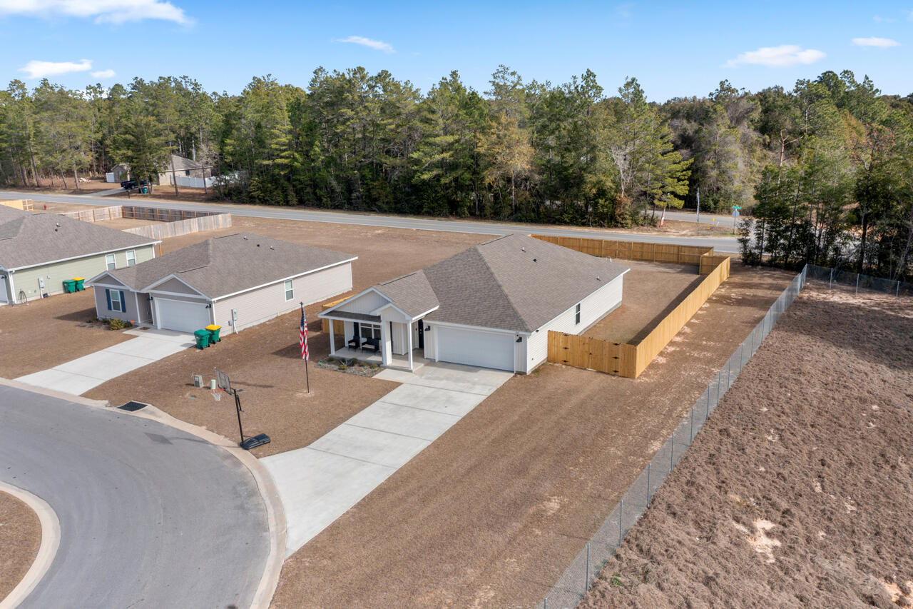 3411 Phoenix Court Crestview, FL 32539 - Photo 41 of 47 an aerial view of a house with a big yard